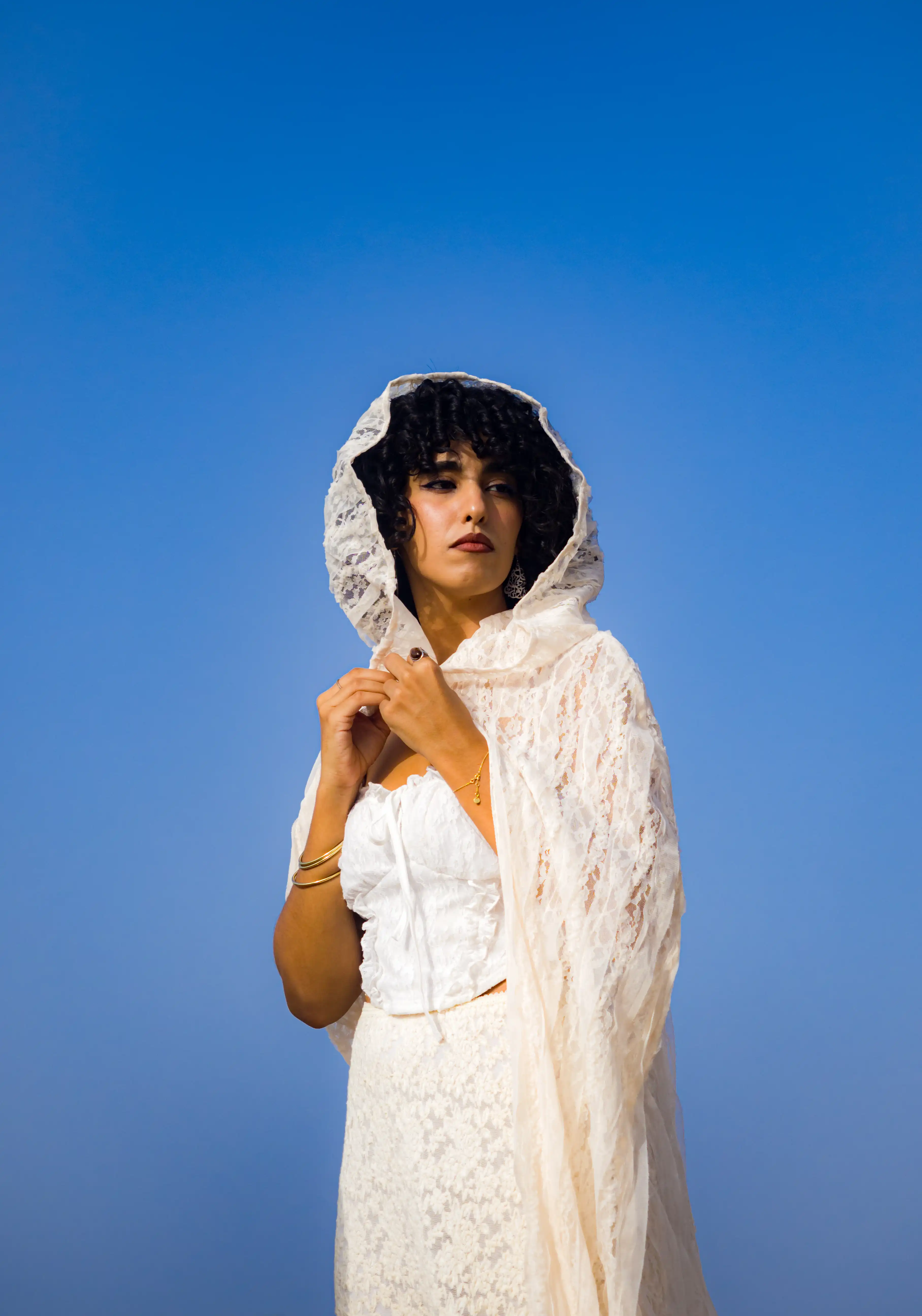 Safia the model posing in a white dress
